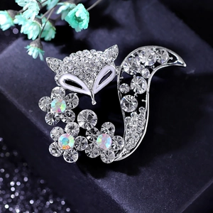 Close-up of crystal fox brooch with silver plating and colorful rhinestones