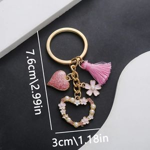 Detailed view of butterfly rose keychain showing 7.6cm x 3cm size with pink heart pendant