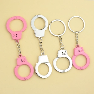 Mini metal handcuff keychains in pink and silver finishes for couples or gifts