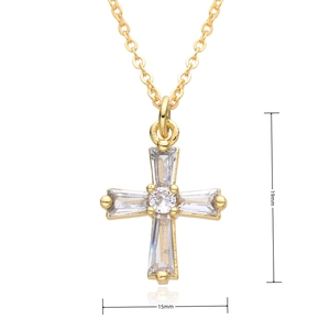 Macro shot of gold cross pendant with dimensions 19mm by 15mm and micro-pave crystals