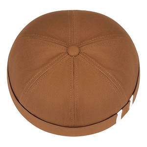 Brown docker hat with white side stripes and button top in a high-angle view