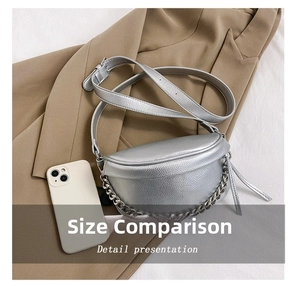 Detail view of silver crescent crossbody bag with lychee texture and metal chain