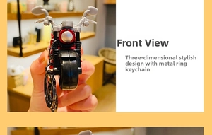 Detail of creative red and black motorcycle keychain with premium metal ring attachment