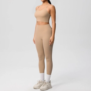 Detail view of khaki yoga set with thin strap sports bra and high-waisted leggings