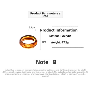 Macro detail of amber acrylic bangle showing dimensions 8cm diameter and 47g weight