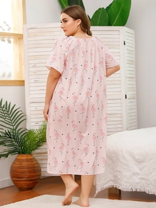 Detailed back view of pink flamingo print nightgown with lace trim and soft fabric