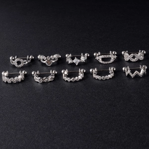 Detailed set of 10 silver stainless steel nipple rings with zircon heart and crown shapes