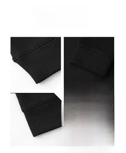 Detailed view of black waffle knit texture on a men's round neck sweatshirt sleeve