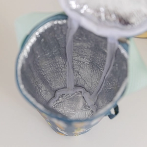 Insulated milk tea cup sleeve with aluminum foil lining and a secure zipper closure