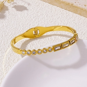 Elegant gold titanium steel bracelet with round and square cubic zirconia crystals