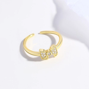 Minimalist 18k gold plated adjustable bow ring featuring sparkling zircon gemstones