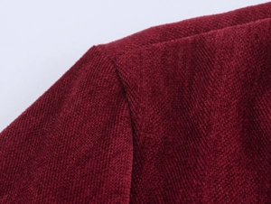 Detailed macro view of elegant wine red chenille fabric texture and shoulder stitching