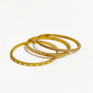 Three-piece gold plated stainless steel bangles with geometric patterns and zircon stones