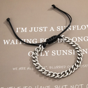 Men's silver Cuban link and black braided rope bracelet with adjustable drawstring