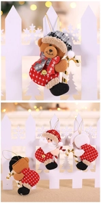 Detail of Santa and bear plush ornaments with knitted textures and festive hanging ropes