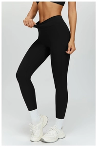 Close-up of black high-waisted yoga leggings with premium matte texture and side-front view