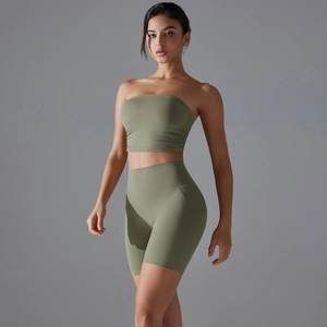 Olive green yoga set featuring a ruched tube top and high-waisted seamless fitness shorts