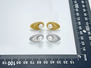 French vintage shell pearl earrings in gold and silver finishes measured with a metric ruler