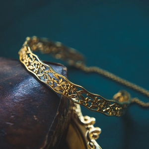 Adjustable hollow vintage 925 silver bangle with gold flower and leaf carvings