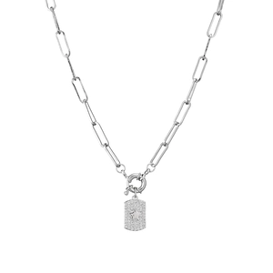 Detail of paperclip chain necklace with a star-embossed rectangle pendant paved in zircon