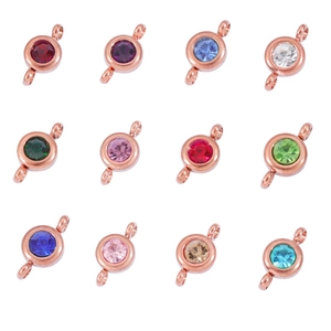 Macro view of 12 color birthstone charms with rose gold base for DIY jewelry making