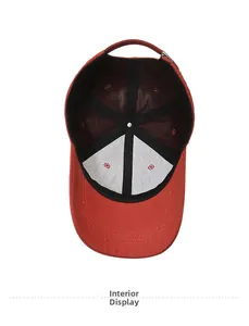 Interior view of red cotton baseball cap showing six-panel stitching and black sweatband