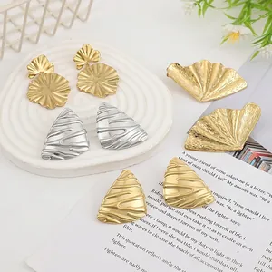 Lava liquid heart and geometric metal earrings with textured hammered finish