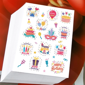 Detail view of layered Happy Birthday envelope seal stickers with festive party patterns