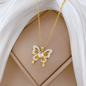 Elegant gold titanium necklace with hollow zircon butterfly pendant on a soft cloth