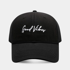 Detailed front view of black cotton baseball cap with white Good Vibes embroidery