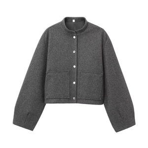Close-up of charcoal gray bomber jacket with silver snaps and textured felt fabric