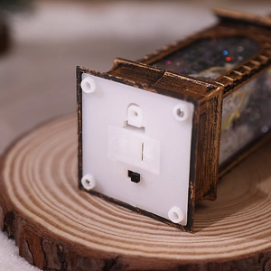Detail of the vintage Christmas lantern base with AG13 battery compartment and power switch