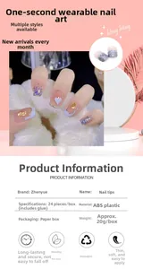 Detail of short square press-on nails in creamy blue with heart patterns and gold foil