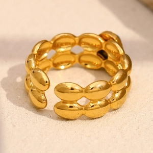 Detail of double-row gold beaded open ring with a polished 18K stainless steel texture