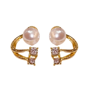 Elegant C-shaped gold-tone pearl earrings with sparkling zircon accents on white background