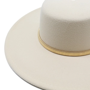 Detail of elegant cream wool felt fedora featuring a decorative gold spring metal band