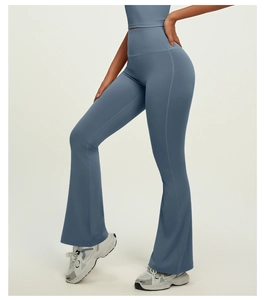 Macro shot of high-waisted flared yoga pants with durable side stitching and blue fabric