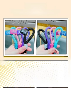 Detail of woven hand ropes in blue, pink, purple, and black with Boom star labels