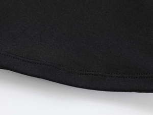 Close-up of premium black elastic fabric showing detailed double-needle hem stitching