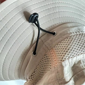 Waterproof sun hat in beige featuring breathable mesh and adjustable drawstring details