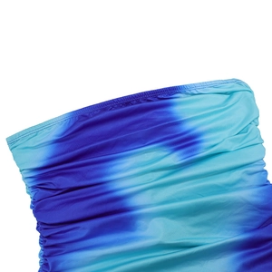 Detail of blue and green gradient tie-dye fabric with ruched texture and fine stitching