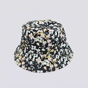 Detail of floral bucket hat showing pink flower prints and stitched brim on black fabric