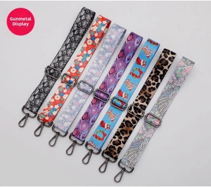 Detail of 8 adjustable bag straps with gunmetal swivel hooks and diverse patterns