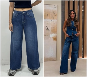 Detail of high-waisted wide-leg denim jeans in dark blue wash with dual front pockets