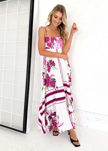 Detail of white floral maxi dress featuring pink purple blossoms and a square neckline