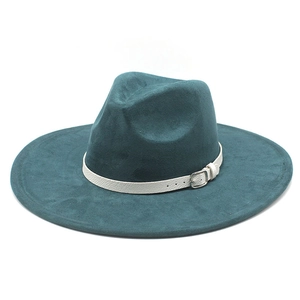 Detailed view of dark green fedora hat with wide brim and white faux leather band detail