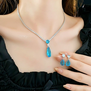 Detail view of a French style water drop blue zircon necklace and earrings jewelry set