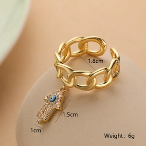 Detailed view of gold chain ring with Hamsa Hand and Evil Eye charms and size specs