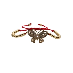 Adjustable gold butterfly charm bracelet with red woven rope and zircon accents