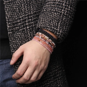 Adjustable 4mm natural gemstone beaded bracelets in various colors worn by model